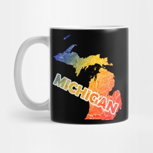 Colorful mandala art map of Michigan with text in blue, yellow, and red Mug